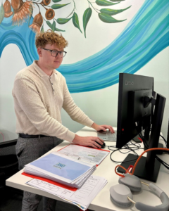 person standing at computer